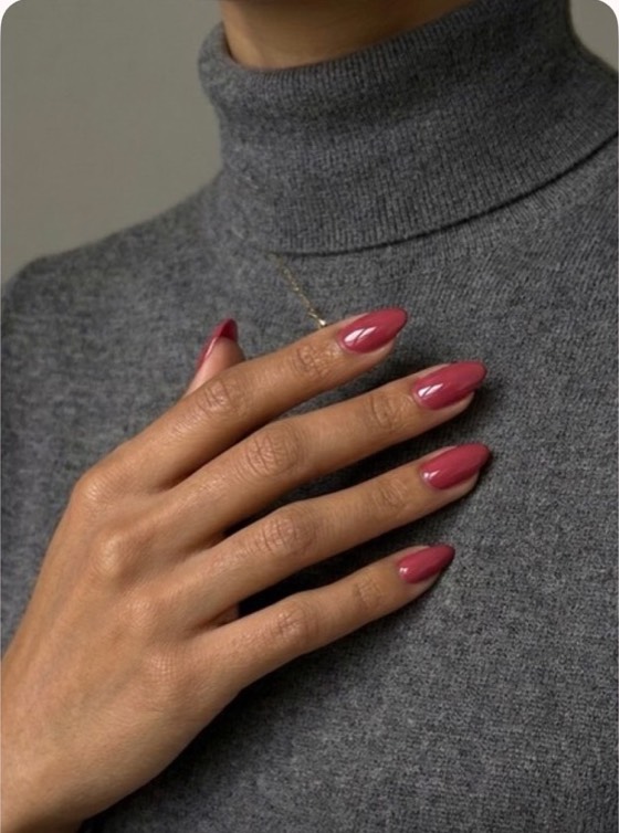 The same hand with rose gold shimmer nails.